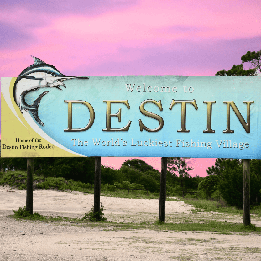 Welcome sign at Destin Beach highlighting must-do activities and fishing village charm