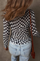 Stylish long sleeve checkerboard shirt women paired with casual jeans for a trendy look