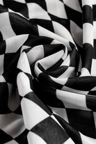 Close-up of long sleeve checkerboard shirt women fabric in black and white pattern
