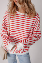 JUNIPER BLVD striped drop shoulder sweatshirt featuring bold red and white stripes for a casual look
