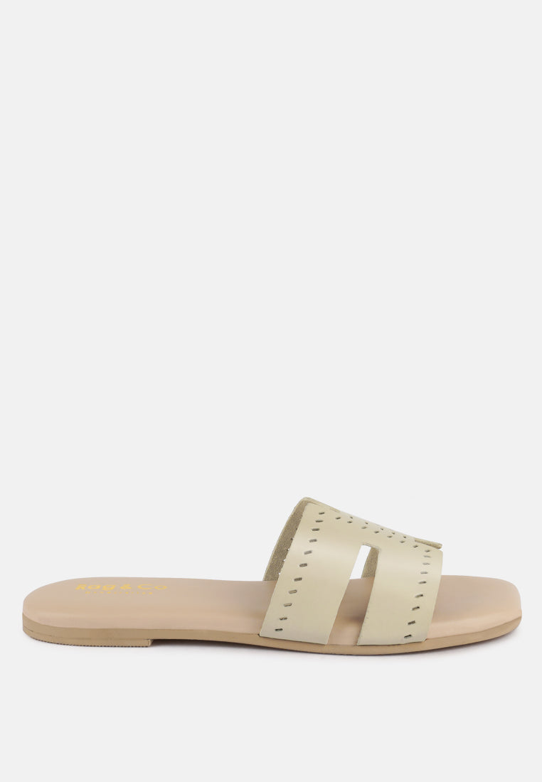 Beige sandal with a strap on a white background