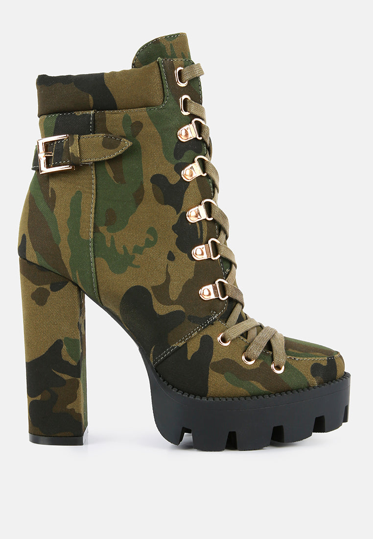 Camouflage high-heeled boot with gold accents on a white background