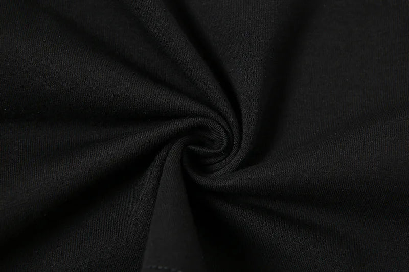 Close-up of black fabric texture for aesthetic streetwear summer top by VacationGrabs