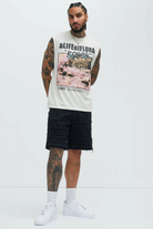 VacationGrabs men's summer streetwear sleeveless shirt with graphic print paired with black shorts and white sneakers
