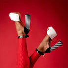 Stylish women's ankle strap square heel shoes in black and white with a bold design
