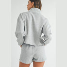 YNIQUE gray vacation athleisure wear for women featuring a long sleeve top and matching shorts set