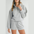 YNIQUE gray two-piece set featuring a zip-up top and shorts vacation athleisure wear for women