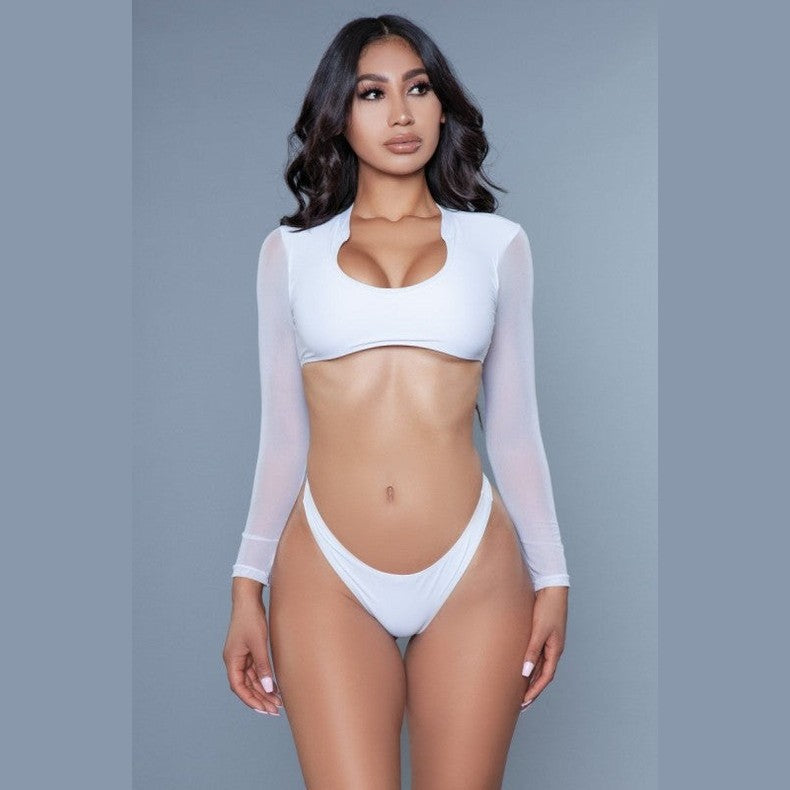 Model wearing BE WICKED 1980s inspired crop swim set white long sleeve scoop crop top and high cut bikini bottoms