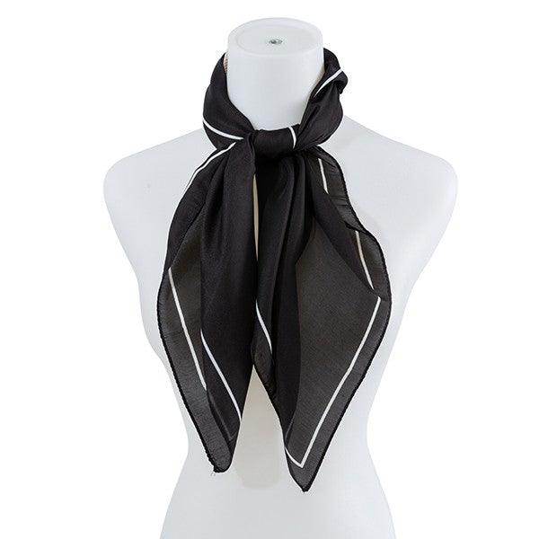 Stylish black scarf with white trim, perfect for pairing with the beige silk scarf for a chic look