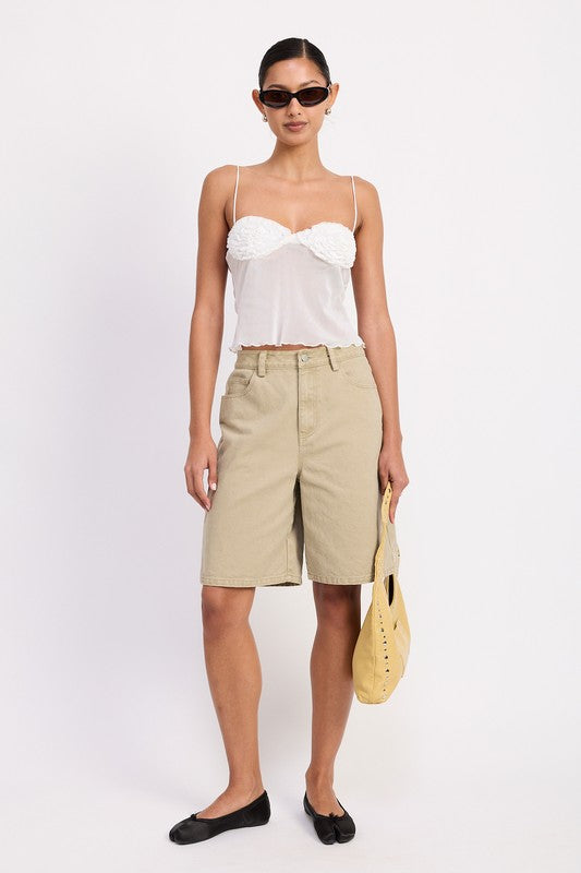 Model wearing Emory Park sheer mesh floral cami top in white with khaki bermuda shorts and yellow bag