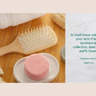 BeNat natural wooden detangling brush on a wooden surface with eco-friendly accessories
