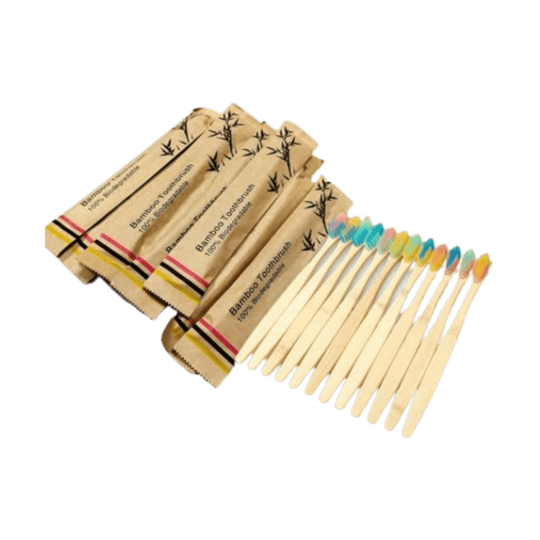 Set of biodegradable bamboo toothbrushes packed in eco-friendly wrappers for travel essentials