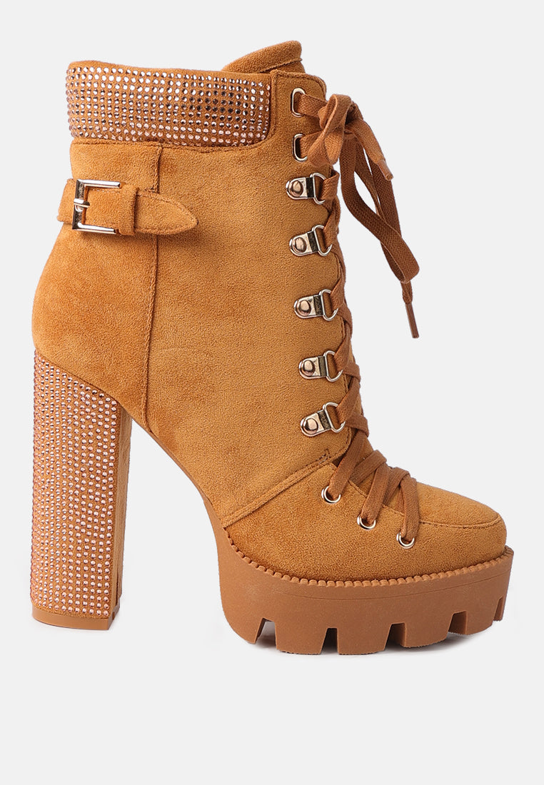 Tan high-heeled boot with rhinestone details on a white background