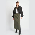 Fashionable black brown bomber jacket with oversized pockets styled with a long skirt