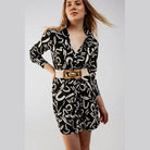 Stylish black button front shirt dress with abstract patterns and a statement belt for trendy women