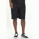 Stylish black cage outfit for men featuring comfortable shorts for casual wear