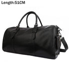 Black leather weekend bag with sturdy handles and adjustable shoulder strap for stylish travel
