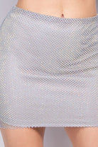 VacationGrabs black rhinestone mesh skirt with sparkling silver embellishments on model