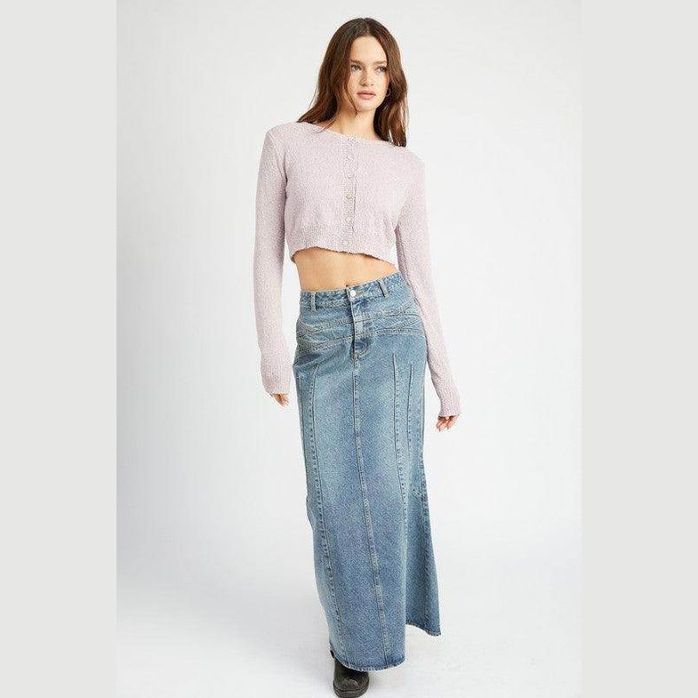 Model wearing a Blue Fluted Jean Skirt paired with a cropped sweater for a stylish look