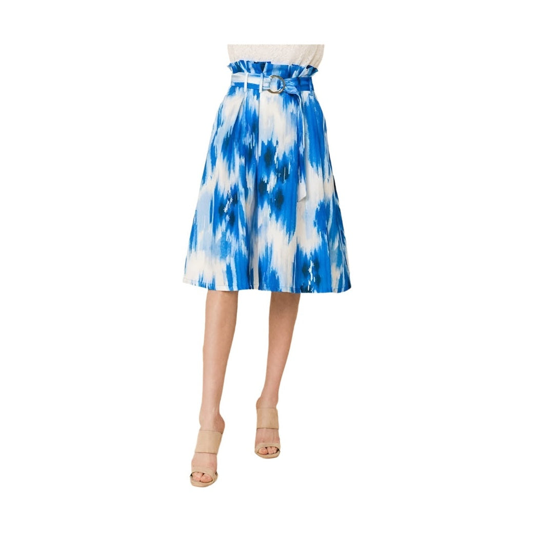 VacationGrabs blue midi vacation skirt with belt and abstract pattern on model wearing neutral heels