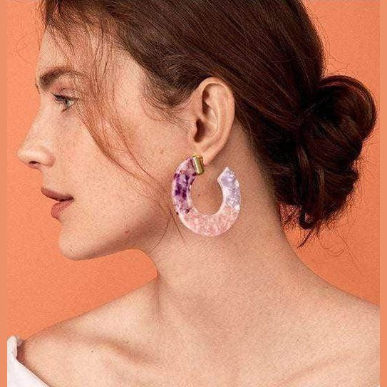 ClaudiaG Collection blue resin hoop earrings showcased on a model for stylish summer outfits