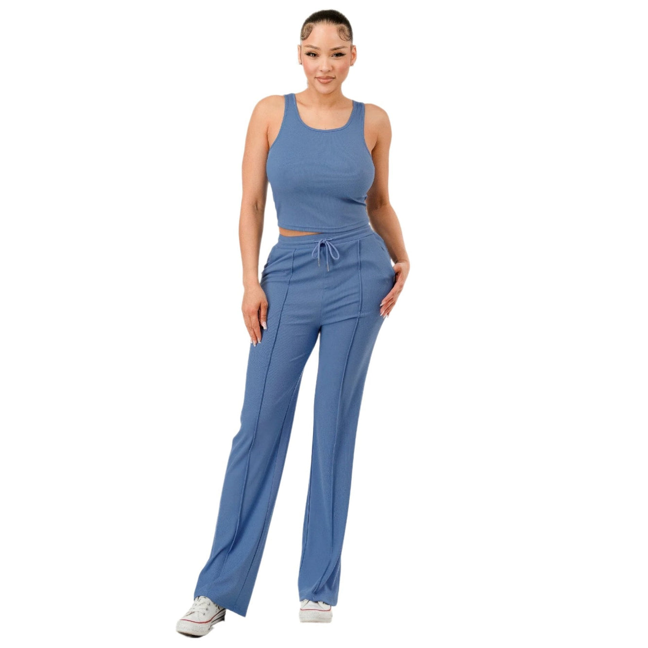 Woman wearing blue ribbed matching set with tank top and drawstring pants by VacationGrabs