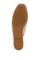 Sole view of women's bow accent flat mules by Rag Company in beige with textured outsole