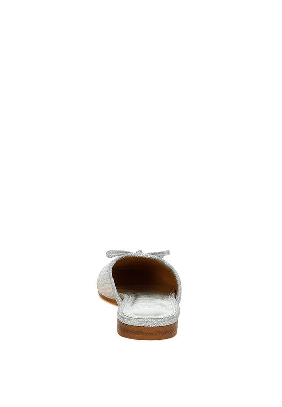 Rag Company women's bow accent flat mules in white with textured design and low wooden heel