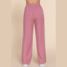 VacationGrabs lightweight travel pants for women in soft pink with elastic waistband and wide legs