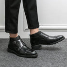 British luxury ankle boots from VacationGrabs for stylish men, featuring a sleek black design with buckles.