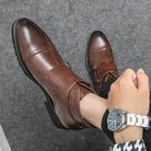 Elegant British luxury ankle boots in brown leather for stylish men's footwear