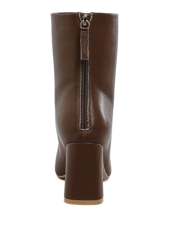 Stylish brown vegan leather ankle boots with a chunky heel and zipper detail