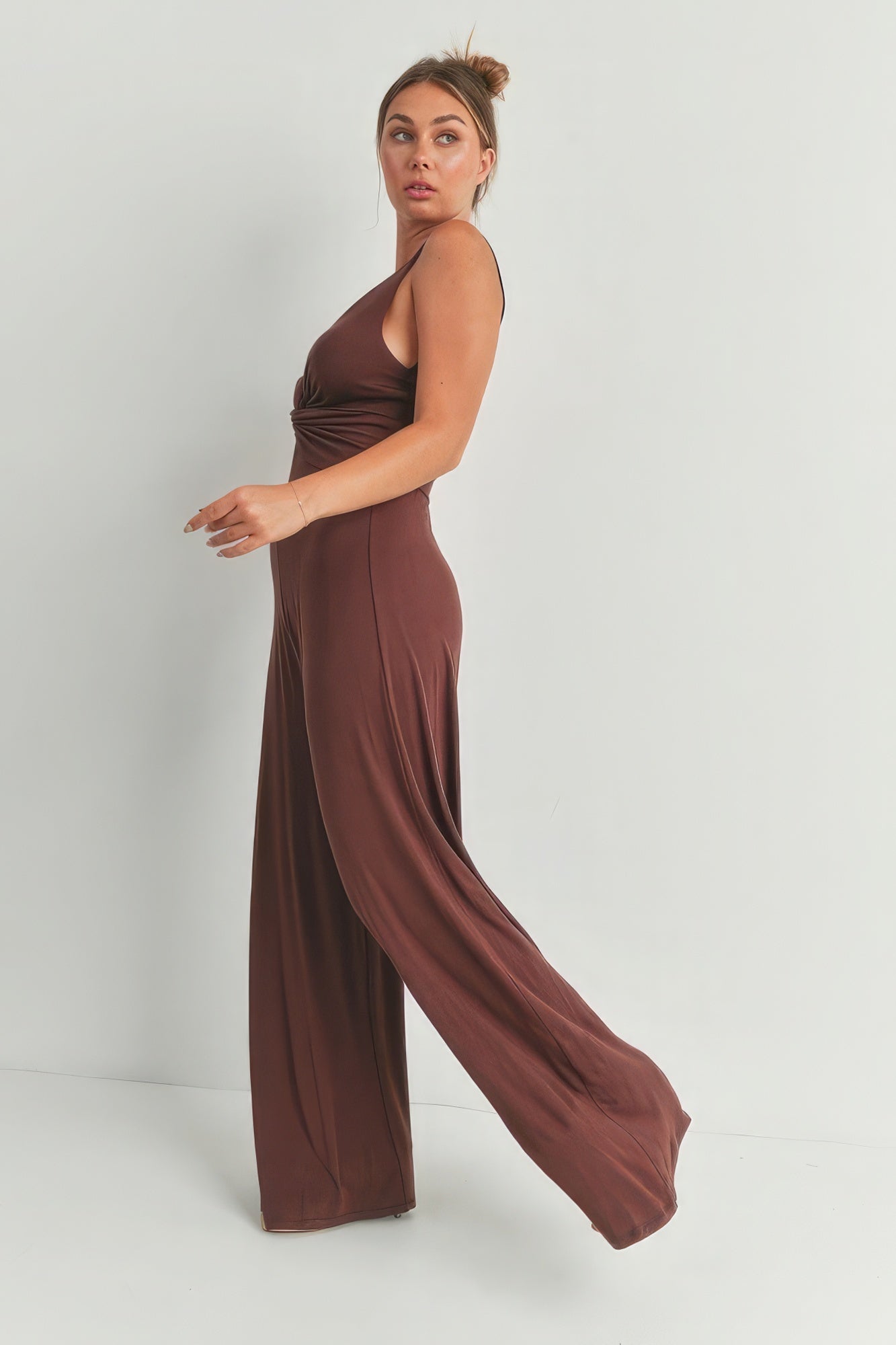Elegant brown wide leg romper with a flattering twist design, perfect for casual outings