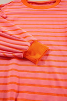 JUNIPER BLVD striped drop shoulder sweatshirt in pink and orange colors with ribbed cuffs