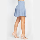 VacationGrabs casual A-line corduroy skirt in light blue worn with beige high heels