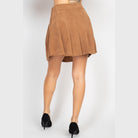 VacationGrabs casual A-line corduroy skirt in brown worn with black heels shown from the back