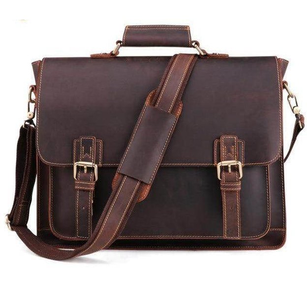 Stylish brown leather briefcase with adjustable strap, perfect for a casual blue messenger bag look