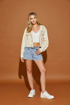 Casual hooded jean jacket by Mustard Seed styled with a white crop top and denim shorts