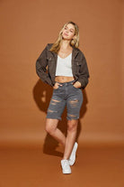 Mustard Seed casual hooded jean jacket styled with a white crop top and denim shorts