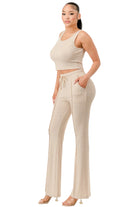 VacationGrabs casual two piece outfit for summer in beige featuring a sleeveless crop top and drawstring wide-leg pants