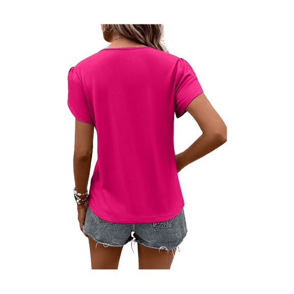 Back view of a pink women's casual v-neck vacation shirt styled with denim shorts