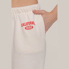 VacationGrabs women's casual vacation lounge pants in white with red California 1992 print and elastic waistband