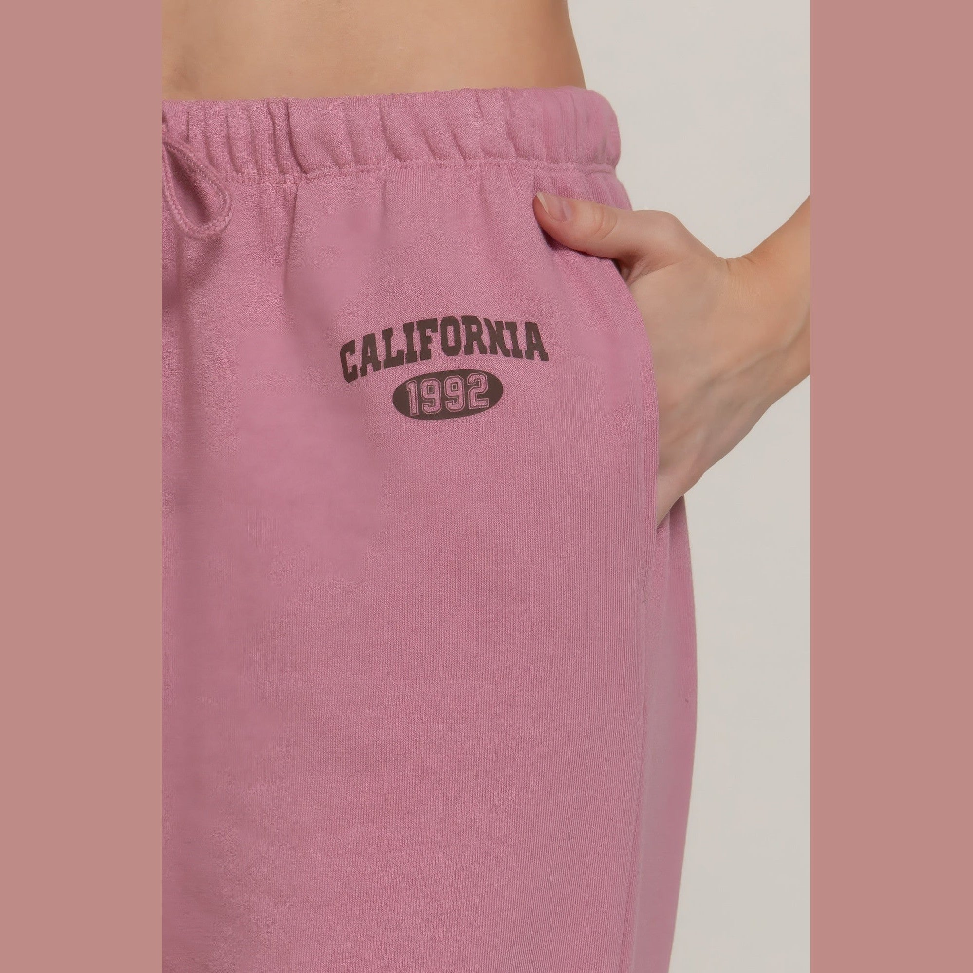VacationGrabs women's casual vacation lounge pants in pink with California 1992 print and elastic waistband