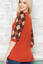 Checker pattern women's top with puffed sleeves in warm autumn colors for stylish comfort