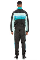 Black and teal chevron track suit for men featuring a zip-up jacket and matching pants