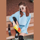 HYFVE Women's Chill Babe Shorts in light blue paired with a matching top and fashion sunglasses