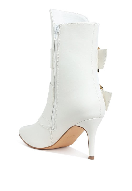 White chunky buckle ankle boots with a sleek design and zipper closure for stylish outfits