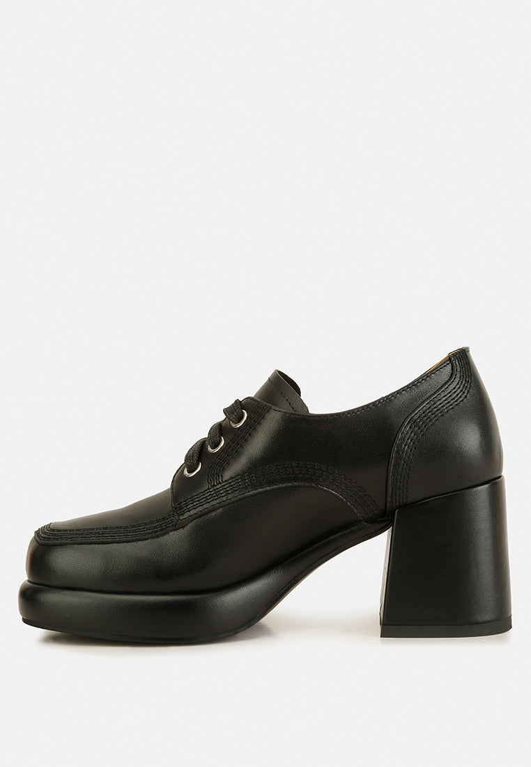 Stylish chunky heel loafers for women in black leather with lace-up design for a modern look