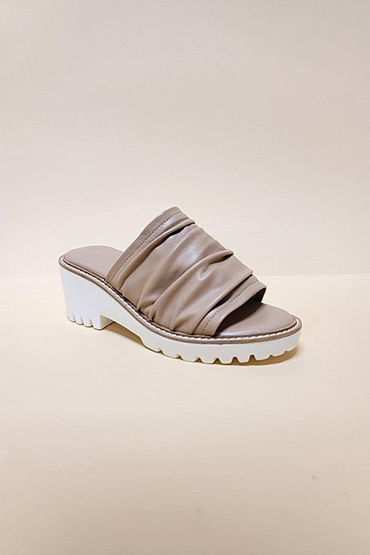 Taupe chunky heel slip-on sandals with ruched strap and white sole by Let's See Style