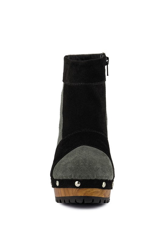 Stylish chunky heel suede boots for women with a unique design and durable sole.